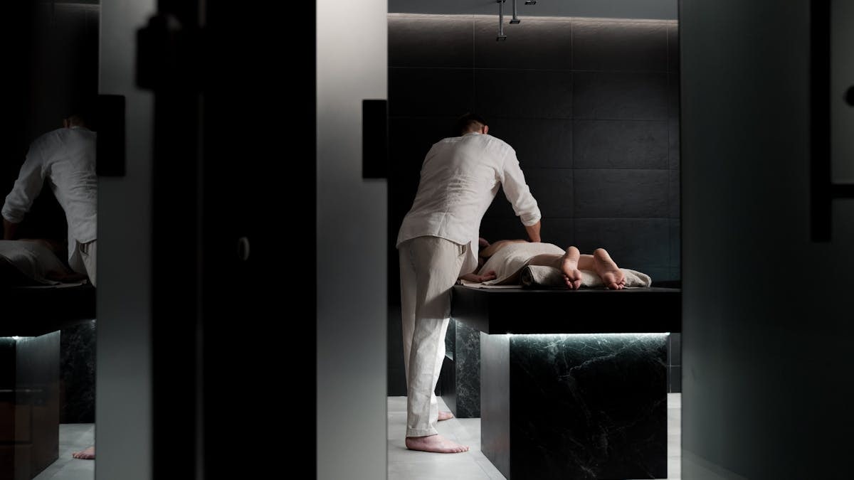 A relaxing massage in a modern spa room promoting wellness and self-care.